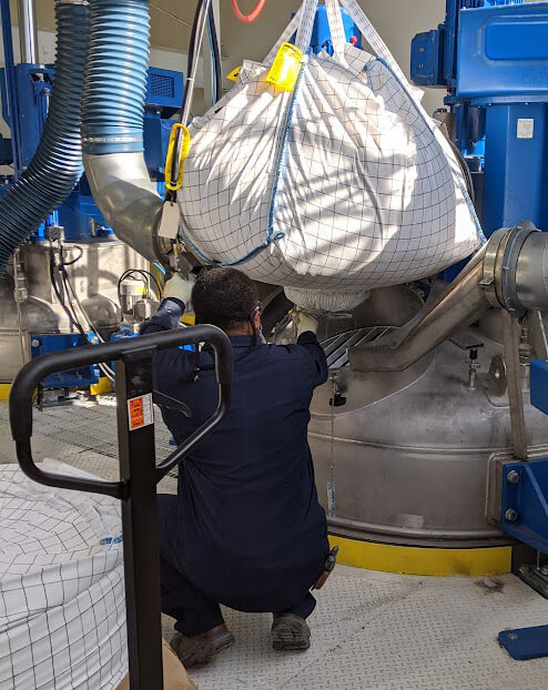 Image of a worker with a suspended bulk bag